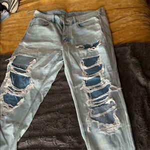 Double layered distressed jean